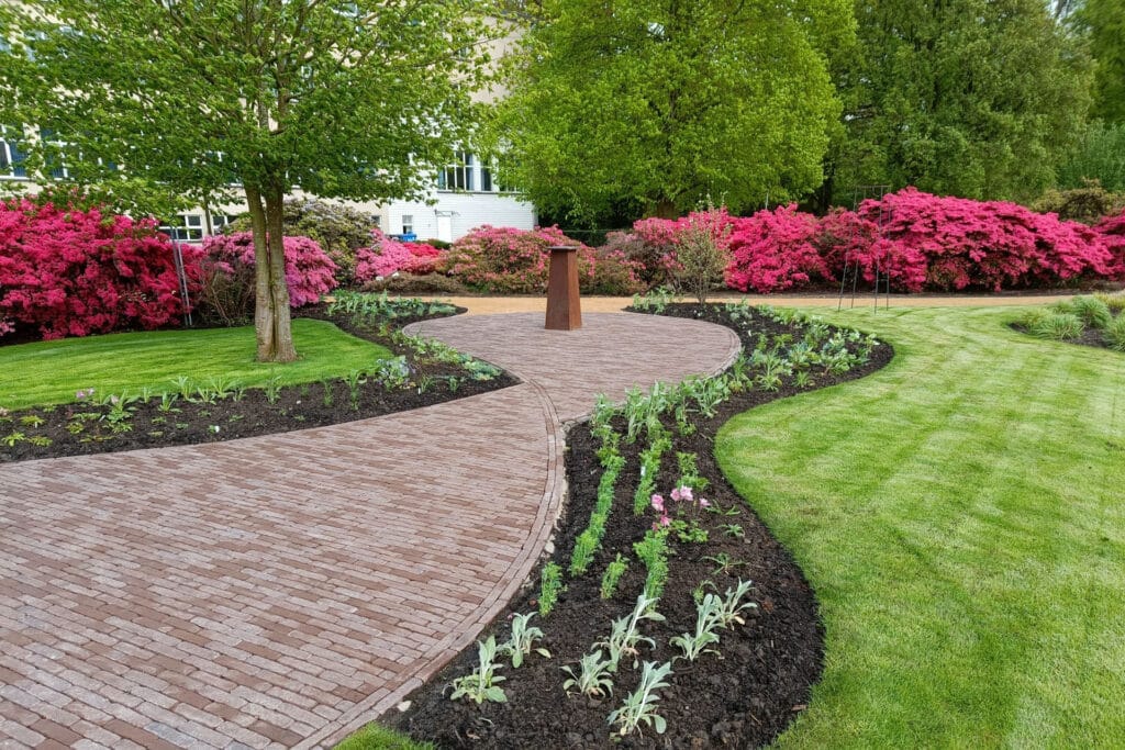 Waterdoorlatende bestrating in Passietuin Tectura Melle: harmonie tussen natuur en innovatie 2